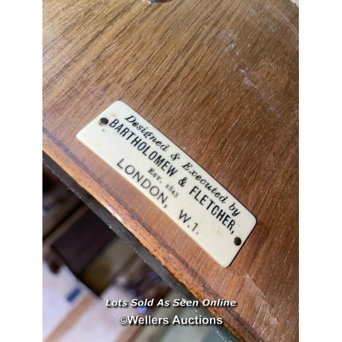 57 - A late 19th or early 20th century Bartholemew and Fletcher walnut veneered dressing table, with serp... 