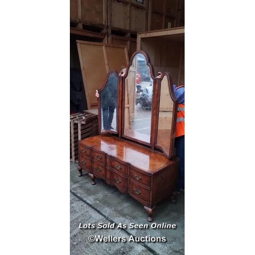 57 - A late 19th or early 20th century Bartholemew and Fletcher walnut veneered dressing table, with serp... 