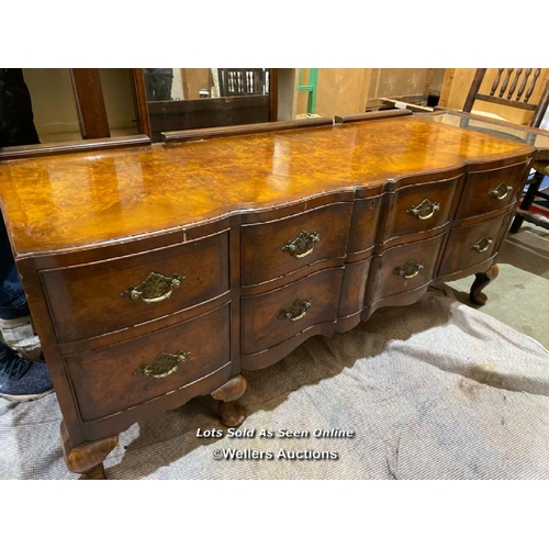 57 - A late 19th or early 20th century Bartholemew and Fletcher walnut veneered dressing table, with serp... 