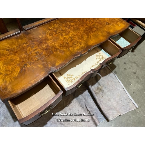 57 - A late 19th or early 20th century Bartholemew and Fletcher walnut veneered dressing table, with serp... 