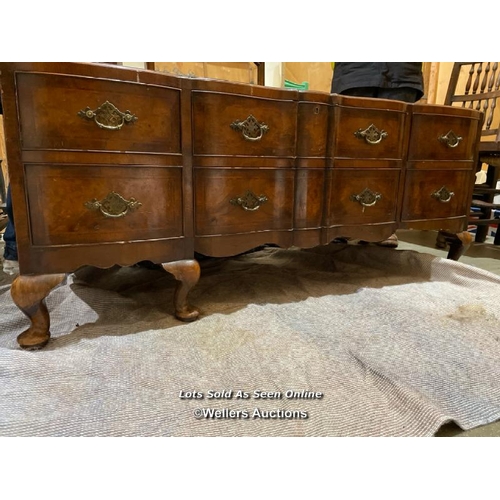 57 - A late 19th or early 20th century Bartholemew and Fletcher walnut veneered dressing table, with serp... 