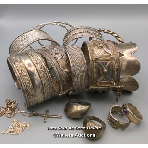 16 - A quantity of jewellery mostly stamped 925 comprising ten bangles, four rings including one set with... 