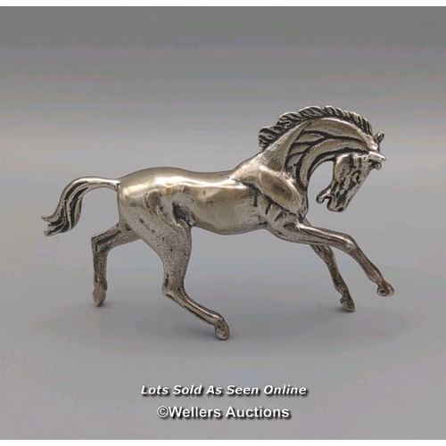 6 - Solid silver horse model stamped 925, gross weight 79g. Length 8.5cm, height 5.5cm.