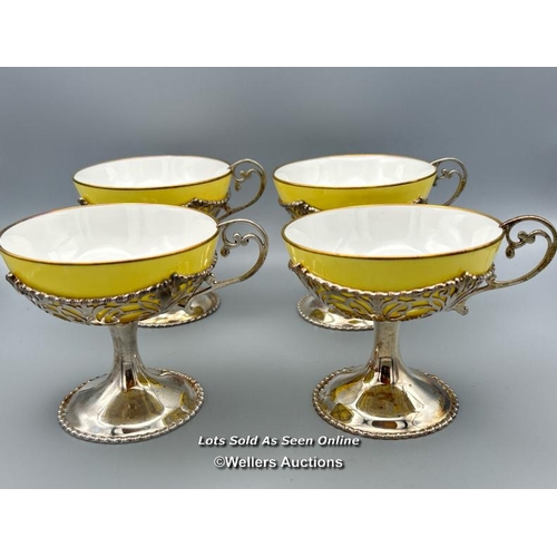 48 - Mappin & Webb set of four yellow and white bone china sundae cups with hallmarked silver pierced sur... 