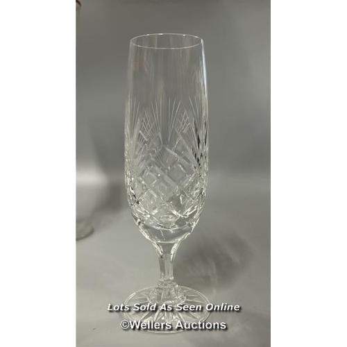 100 - Ten crystal champagne glasses, 18cm high with three large champagne flutes, 25cm high / T43