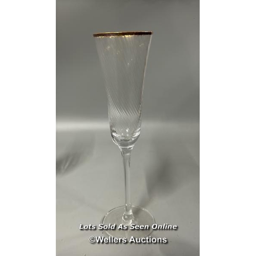 100 - Ten crystal champagne glasses, 18cm high with three large champagne flutes, 25cm high / T43