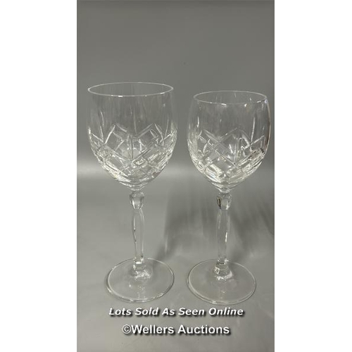 101 - A matching collection of tall stem crystal wine glasses, ten 20cm high and eleven 19.5cm high / T44