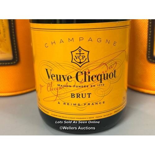 128 - A bottle of Veuve Clicquot Champagne Brut, 750ml, 12% Vol. with two Veuve Clicquot cases.