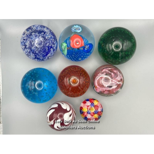 66 - Eight glass paperweights, largest 8cm high