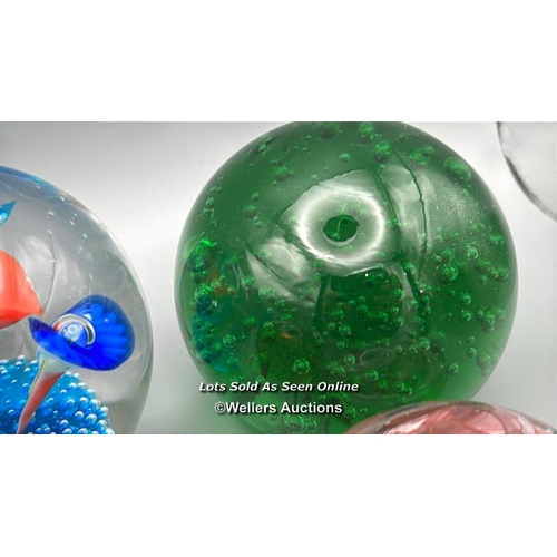 66 - Eight glass paperweights, largest 8cm high