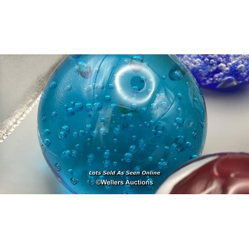 66 - Eight glass paperweights, largest 8cm high