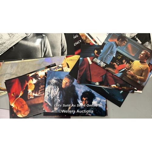 164 - Star Trek - a large collection of lobby cards, movie stills, postcards, DVD's, patches and badges