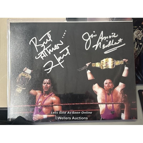 171 - WWF Wrestling / Bret Hart - memorabilia including three Bret hart signed pictures, books, collectabl... 