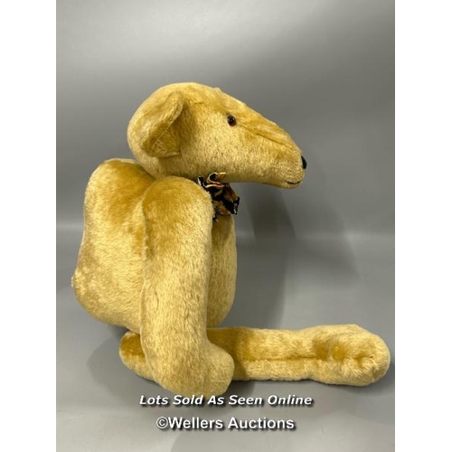 179 - A large blonde humpback teddy bear with elongated snout by Tillingbourne Bears, hand made, 60cm tall