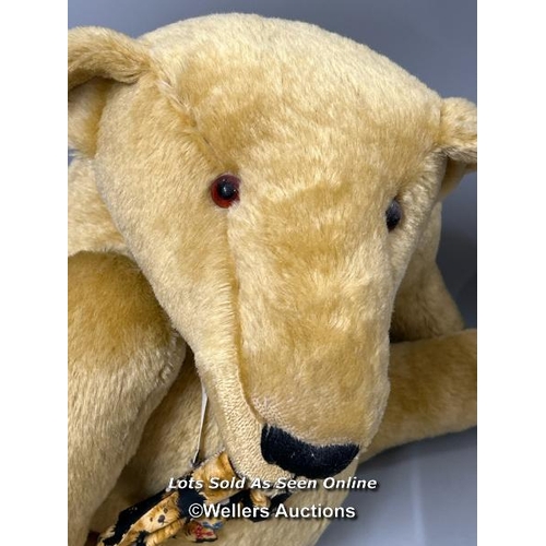 179 - A large blonde humpback teddy bear with elongated snout by Tillingbourne Bears, hand made, 60cm tall