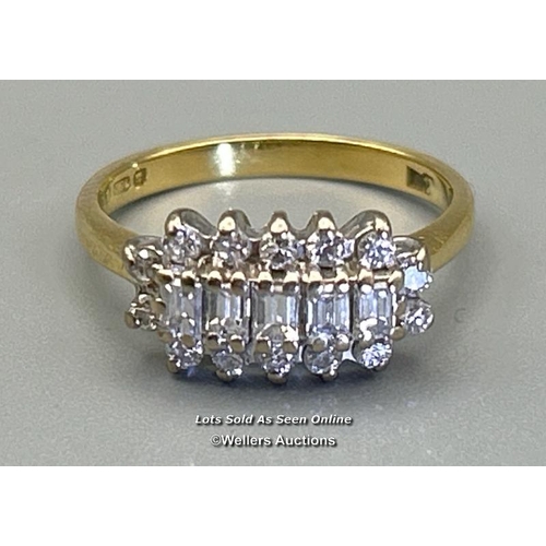 73 - Diamond three stone ring comprising five baguette cut diamonds bordered by 14 round brilliant cut di... 