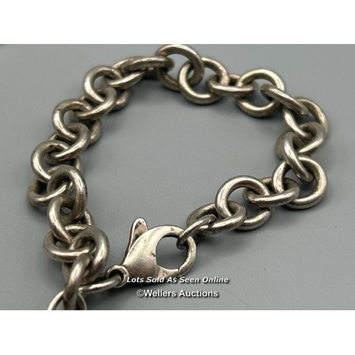 79 - A Tiffany chain bracelet with heart pendant stamped 925, length 19cm, weight 34.9g with six natural ... 