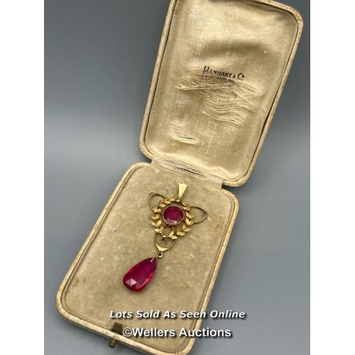 80 - A vintage 1920's 18ct gold pendant with circular and oval synthetic rubies, length 6cm, gross weight... 