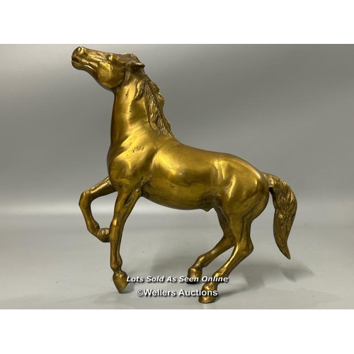 184 - A brass model of a Horse, 26cm high, 23cm long.