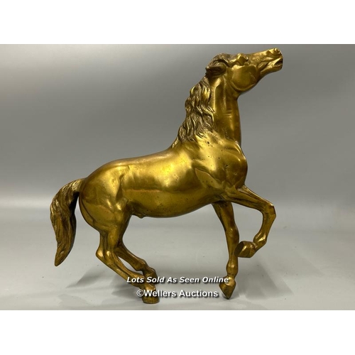 184 - A brass model of a Horse, 26cm high, 23cm long.