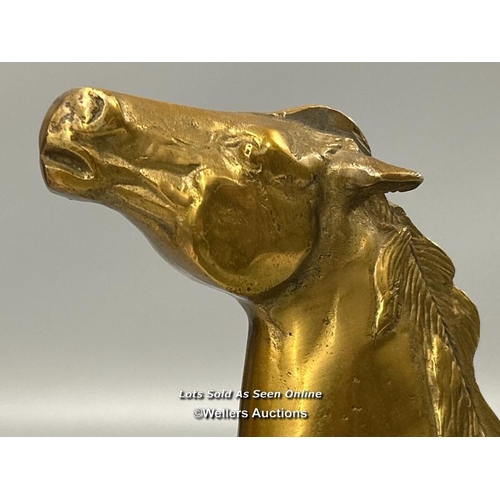 184 - A brass model of a Horse, 26cm high, 23cm long.