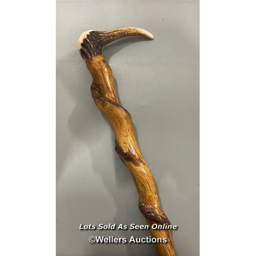 189 - Antler handled walking stick, with brass screw fixing in the middle. 92cm, long.