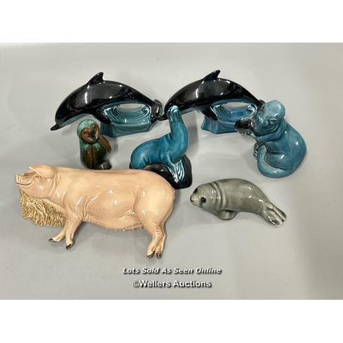 13 - A group of ceramic animals including Poole Pottery Dolphins, Seal and Otter, Seal, Owl and Pig (7) /... 