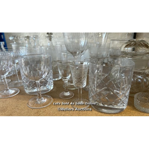 287 - A large collection of glassware including sherry glasses, wine glasses, bottles and perfume bottle /... 