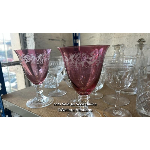 287 - A large collection of glassware including sherry glasses, wine glasses, bottles and perfume bottle /... 