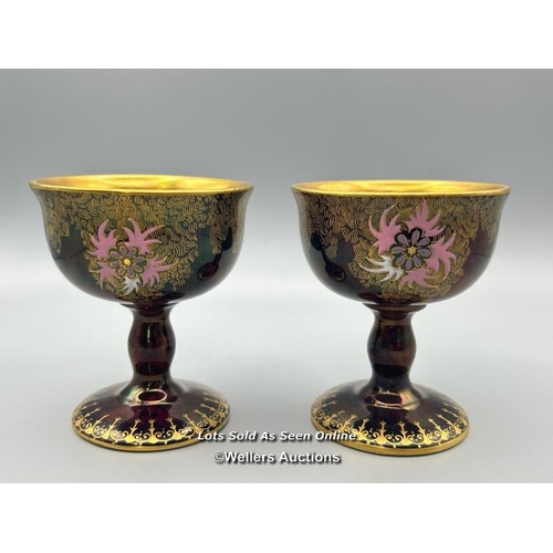 20 - A near pair of Carlton Ware goblets numbered 3889 with floral decoration and gilt interior, 8cm high... 