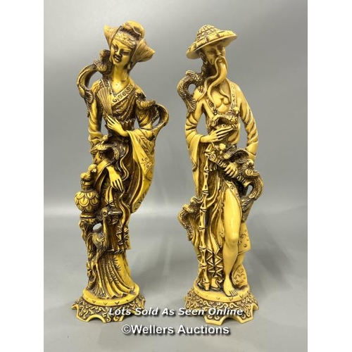 37 - A pair of resin figurines of a Japanese man and women, 36 cm high / AN7