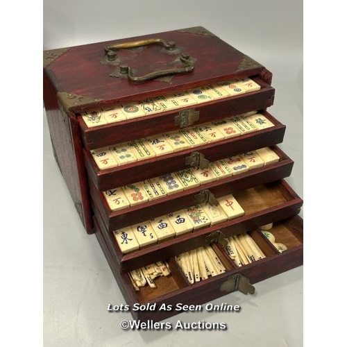 39 - Vintage Mahjong set, c1920's. Bone and bamboo tiles in a wood and brass mounted five drawer case and... 