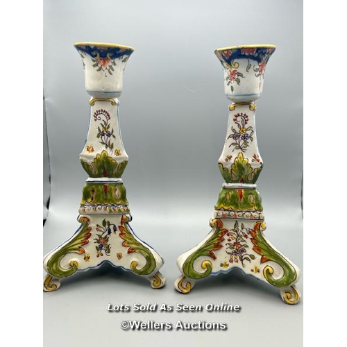 53 - A pair of colourful porcelain candlesticks, 24.5cm high / AN9