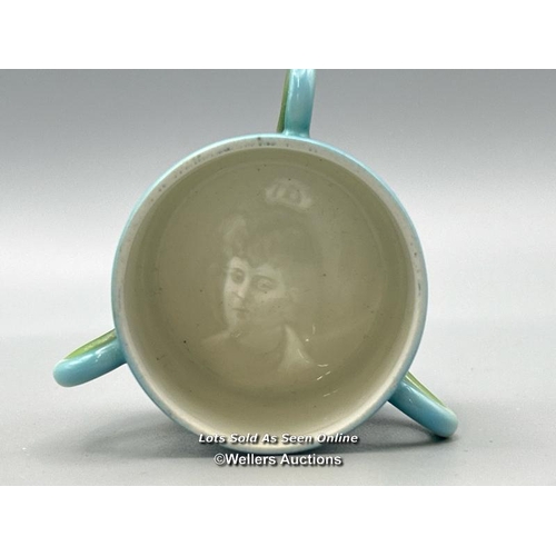 55 - A small childrens three handled lithophane cup showing a portrait of Queen Alexandra at the base, de... 