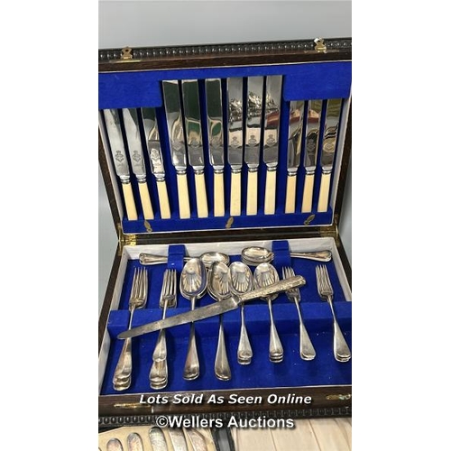 61 - A large collection of EPNS cutlery including Viners canteen of cutlery and crested spoons / AN9