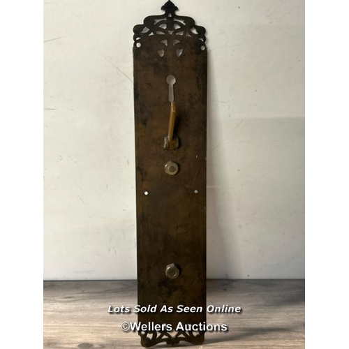 301 - Brass pull door handle on ornately shaped back panel with key hole and lever