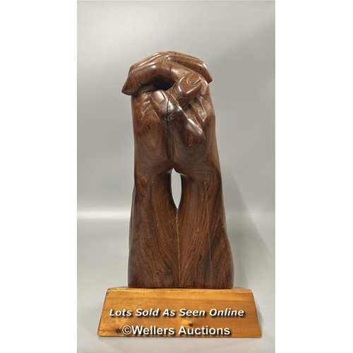 95 - Large carved wooden sculpture of praying hands on a seperate wooden base, 46cm high, base 24.5cm wid... 