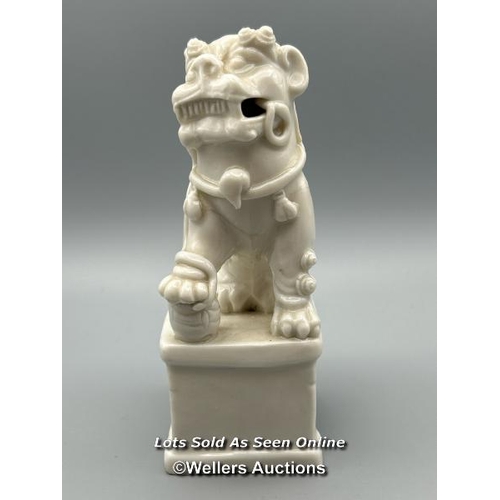 124 - A Chinese Kangxi period Blanc de Chine Dog of Fu or Buddhistic Lion joss stick holder, 13cm high / A... 