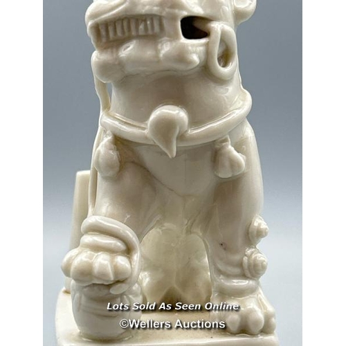 124 - A Chinese Kangxi period Blanc de Chine Dog of Fu or Buddhistic Lion joss stick holder, 13cm high / A... 