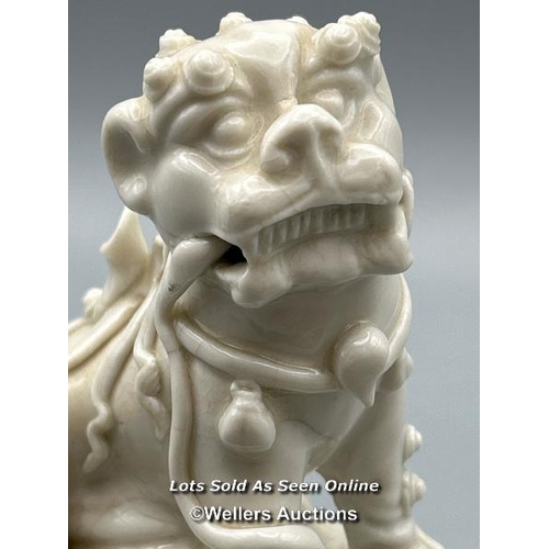 124 - A Chinese Kangxi period Blanc de Chine Dog of Fu or Buddhistic Lion joss stick holder, 13cm high / A... 