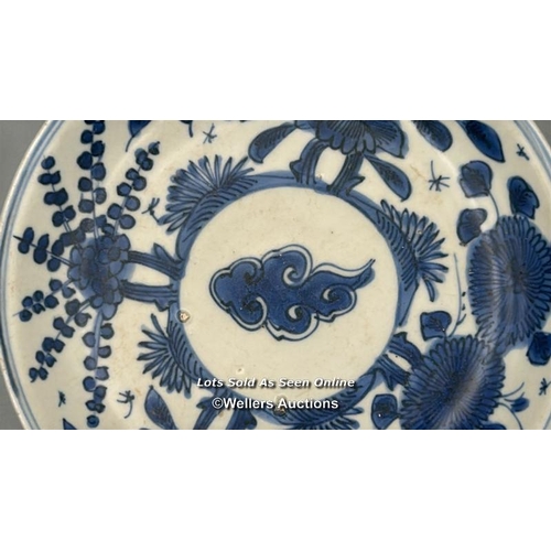 130 - A small Chinese Wanli period blue and white porcelain shallow bowl decorated with a central cloud su... 