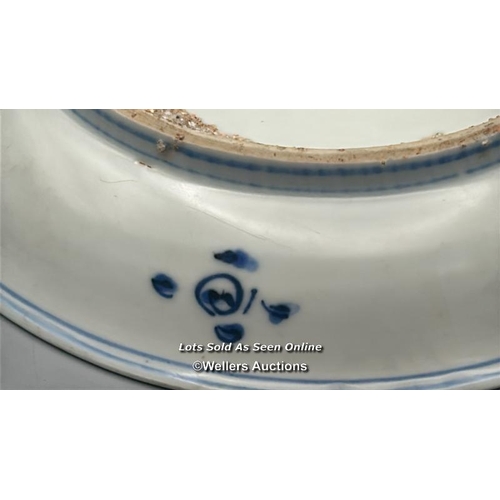 130 - A small Chinese Wanli period blue and white porcelain shallow bowl decorated with a central cloud su... 