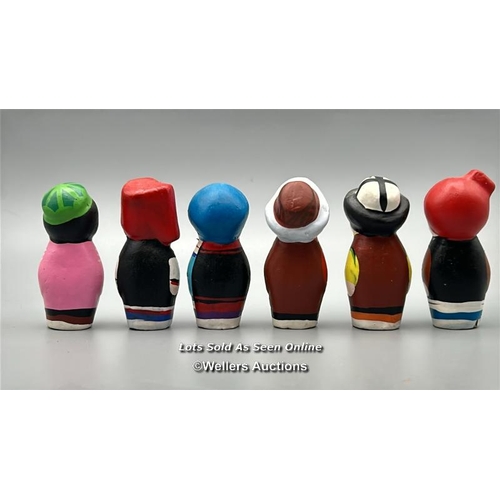 142 - Six small hand painted clay dolls, all around 5cm high / AN47