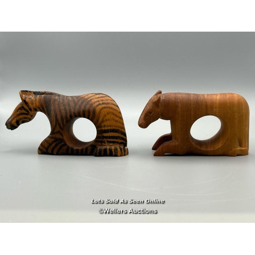 146 - Twelve carved wood napkin rings from Kenya in the form of animals / AN48