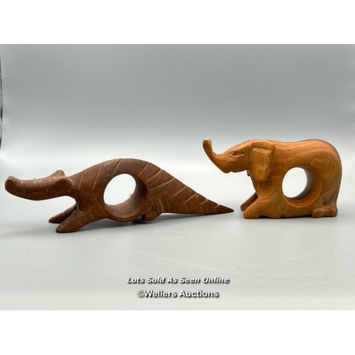 146 - Twelve carved wood napkin rings from Kenya in the form of animals / AN48