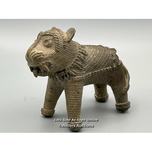 149 - Four brass dhokra cast animals including three Tigers and a Cow, tallest, 7cm high / AN48