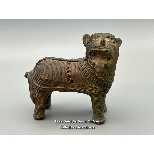 149 - Four brass dhokra cast animals including three Tigers and a Cow, tallest, 7cm high / AN48