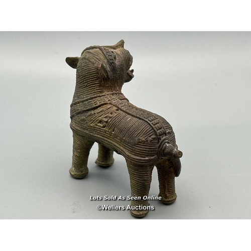 149 - Four brass dhokra cast animals including three Tigers and a Cow, tallest, 7cm high / AN48