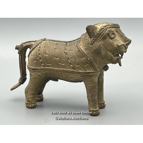 149 - Four brass dhokra cast animals including three Tigers and a Cow, tallest, 7cm high / AN48