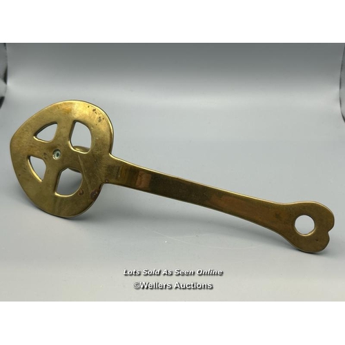 153 - A brass chamberstick with pierced heart shaped base, inscribed 'Luckin Booth, Edinburgh, 1703' 24cm ... 